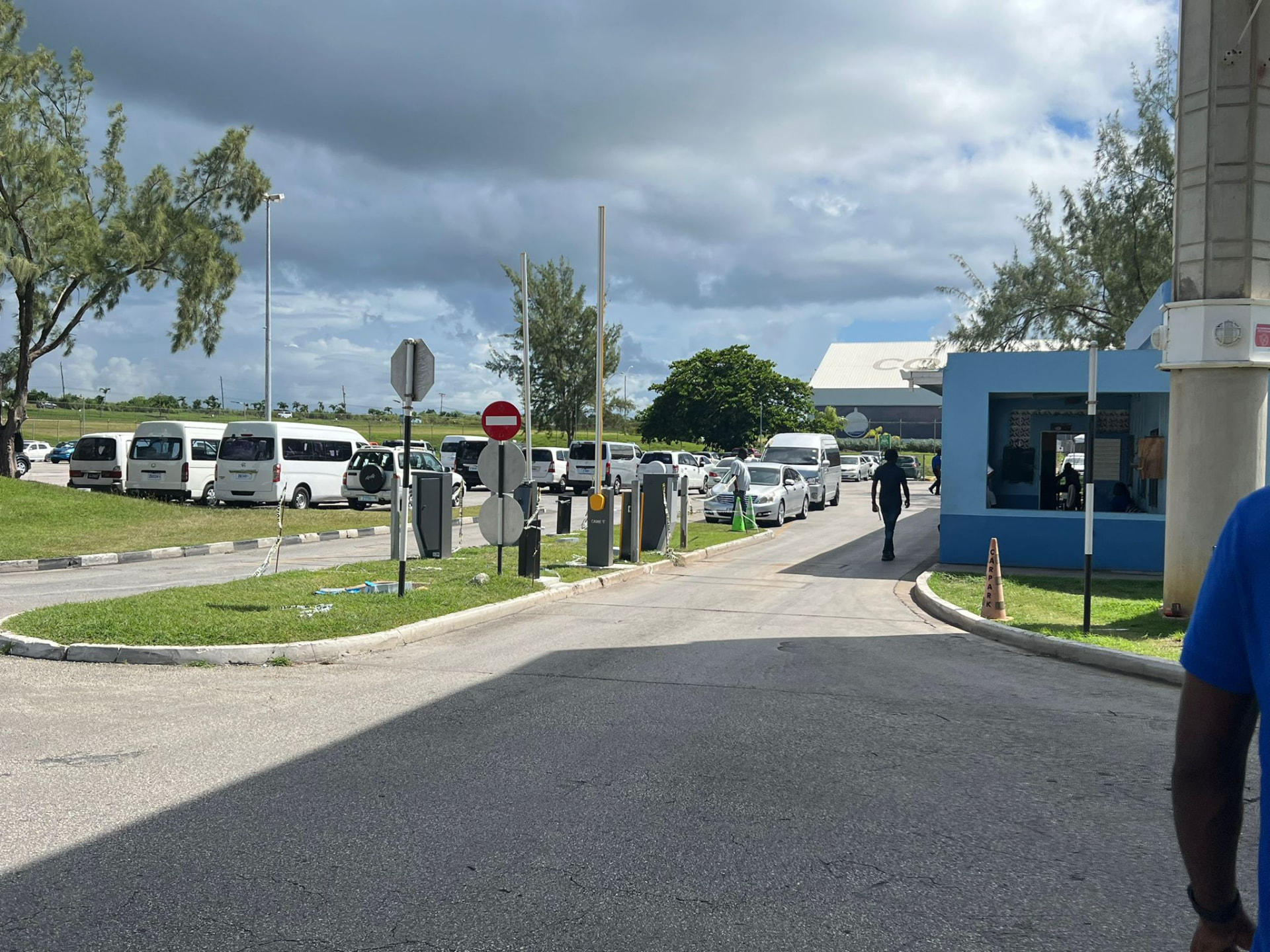 Taxi station and parking area at Grantley Adams International Airport in Barbados where On The House Taxi Service meets arrivals