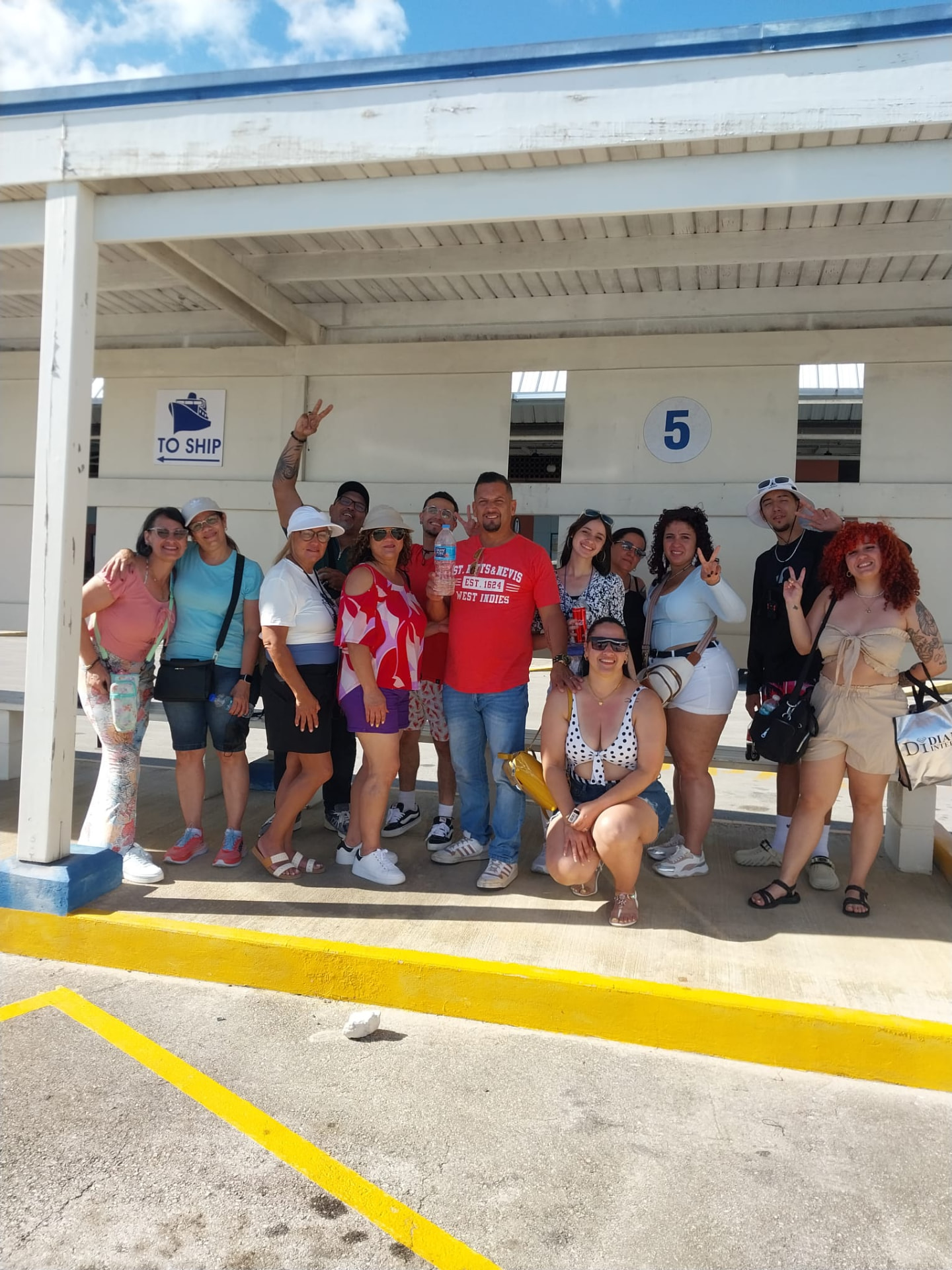Group of cruise passengers with their On The House Taxi Service van at the Bridgetown Cruise Terminal in Barbados