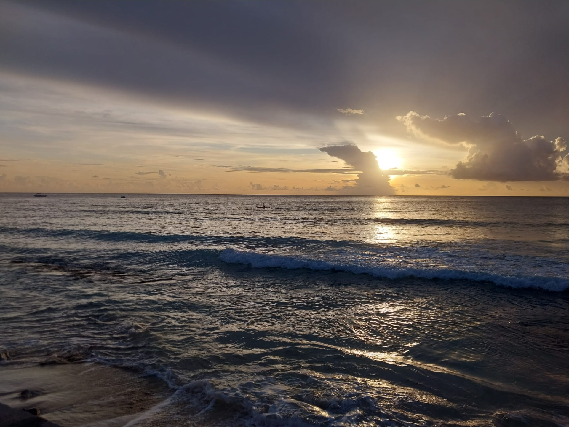 Guests watching the sunset from a Barbados west coast beach during an On The House Taxi Service island tour